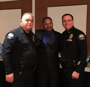 (Left to right) Retired Signal Hill Chief of Police Michael Langston, co-founder of AUHS Pastor Gregory Johnson, and new Signal Hill Chief of Police Chris Nunley at Langston's retirement party at the Petroleum Club on December 10th, 2016.