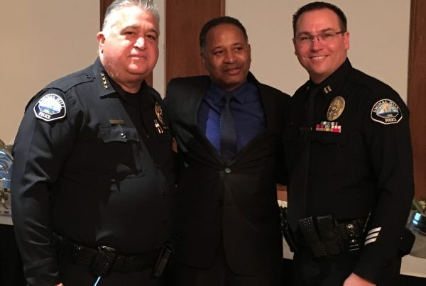 (Left to right) Retired Signal Hill Chief of Police Michael Langston, co-founder of AUHS Pastor Gregory Johnson, and new Signal Hill Chief of Police Chris Nunley at Langston's retirement party at the Petroleum Club on December 10th, 2016.