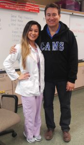 AUHS clinical instructor Kristen Soegeng and her former high school teacher, Gene Patrick Almeida, at CAMS Career Day.